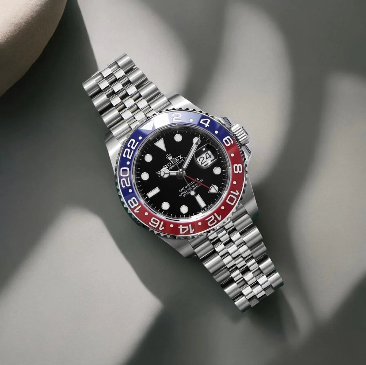 ROLE_X GMT-Master II red and blue Cerachrom bezel black dial and a Jubilee bracelet.